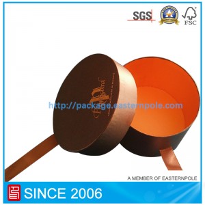 Caja de chocolate redonda de lujo con cierre de cinta.