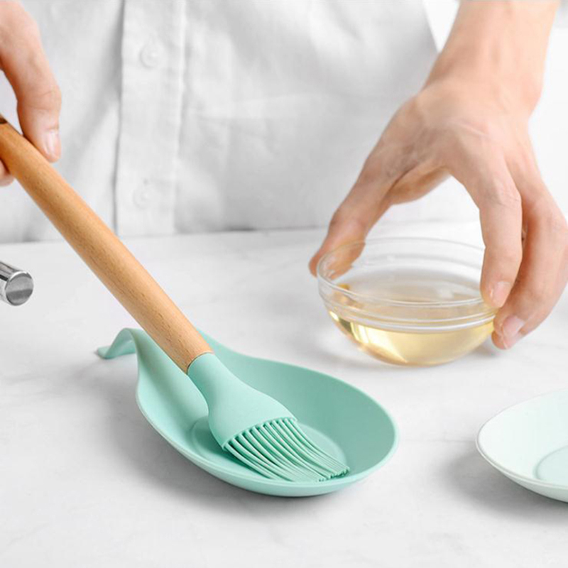 Soporte de cuchara de cocina resistente al calor al por mayor forma de almendras de almendras de silicona de cuchara